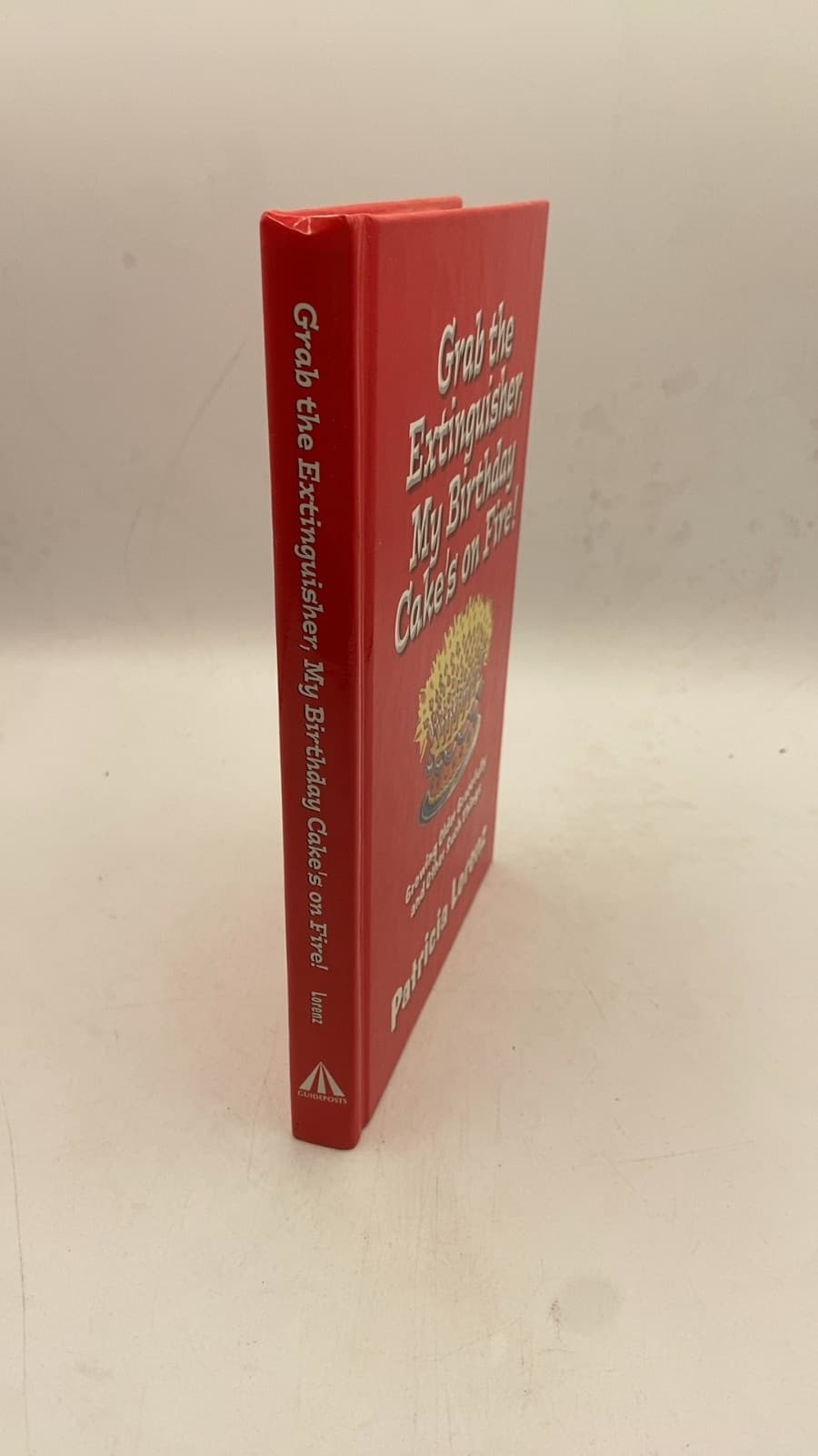 Grab the Extinguisher, My Birthday Cake's on Fire! Growing Older Gracefully and Other Such Things by Patricia Lorenz - front cover