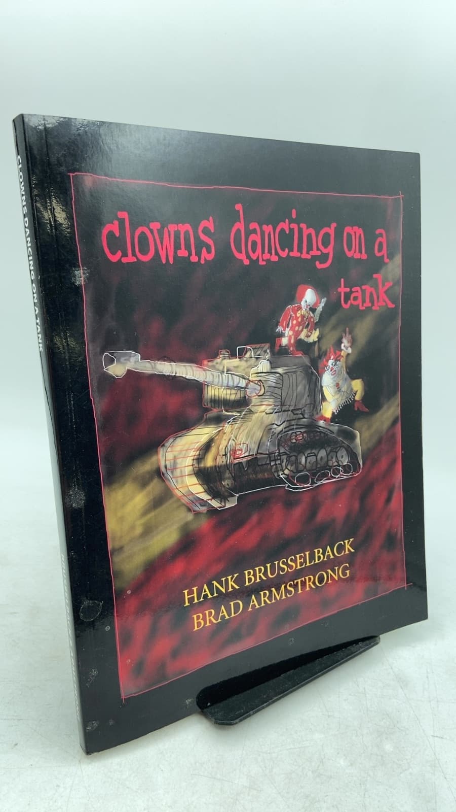 clowns dancing on a tank by Hank Brusselback and Brad Armstrong - front cover
