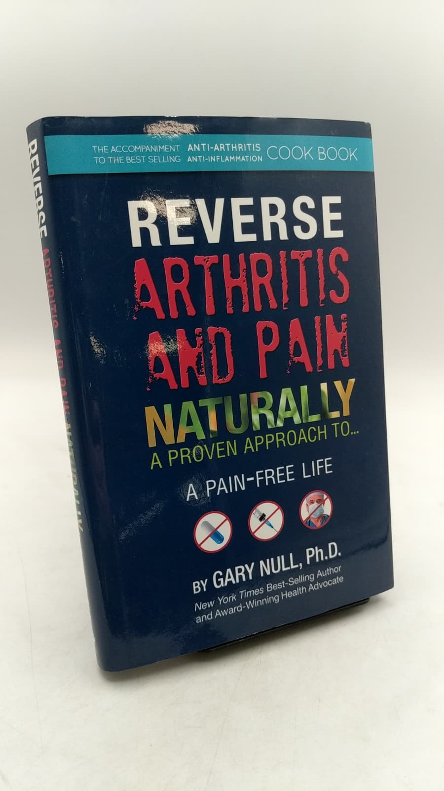 Reverse Arthritis and Pain Naturally: A Proven Approach to an Anti-Inflammatory, Pain-Free Life Signed by Gary Null, Ph.D. - front cover