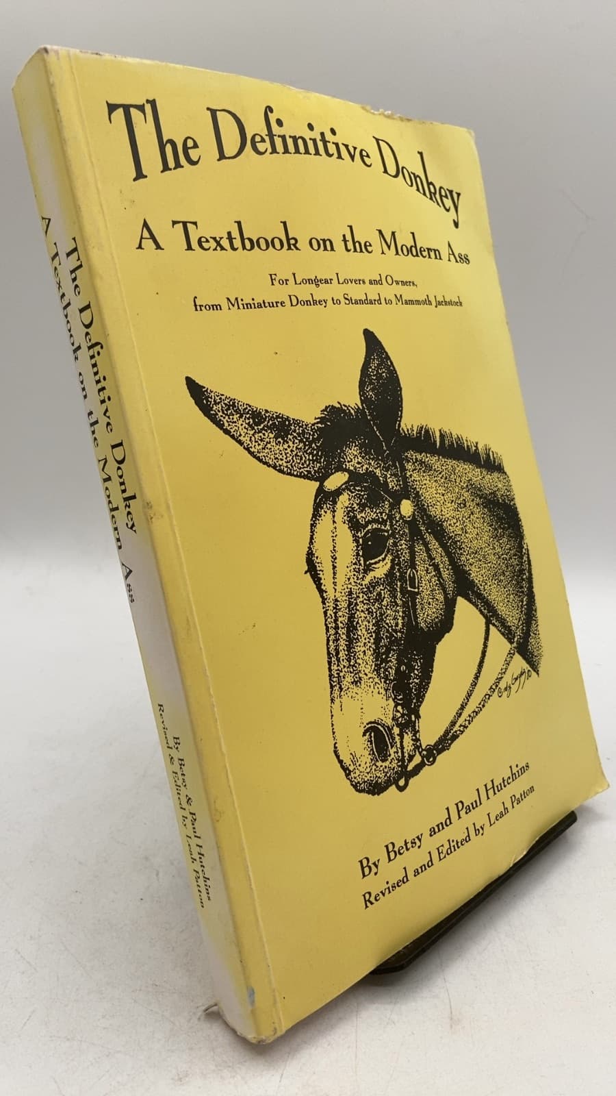 The Definitive Donkey: A Textbook on the Modern Ass by Betsy and Paul Hutchins, Revised and Edited by Leah Patton - front cover