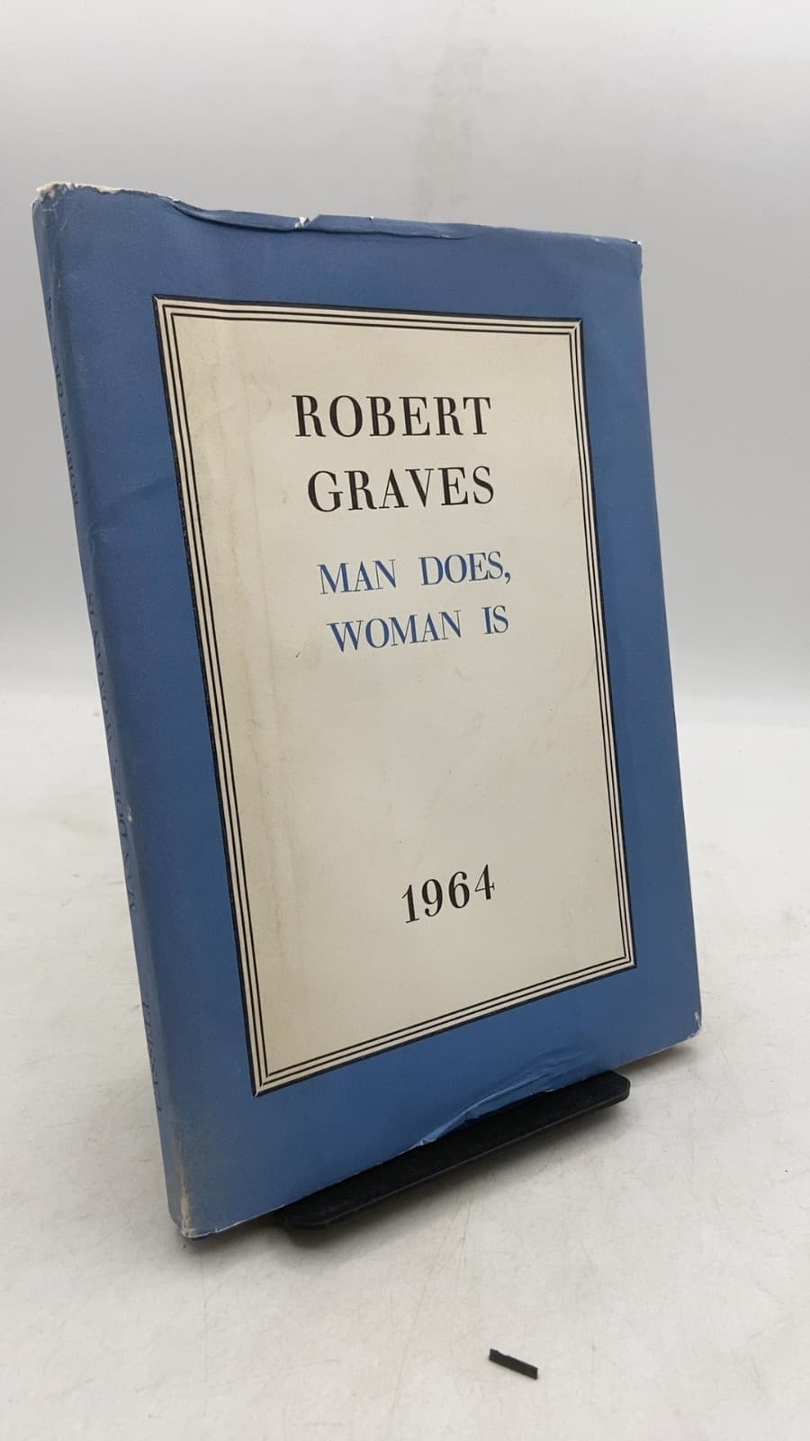 MAN Does, Woman IS by Robert Graves - front cover