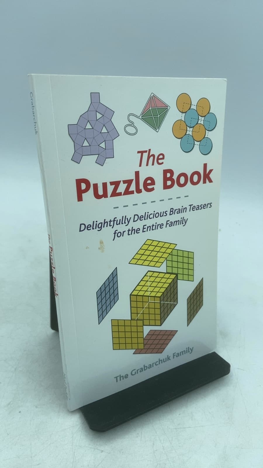 The Puzzle Book: Delightfully Delicious Brain Teasers for the Entire Family by The Grabarchuk Family - front cover
